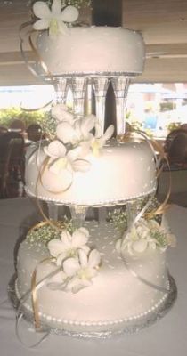 wedding cake tiered cake on columns with orchids